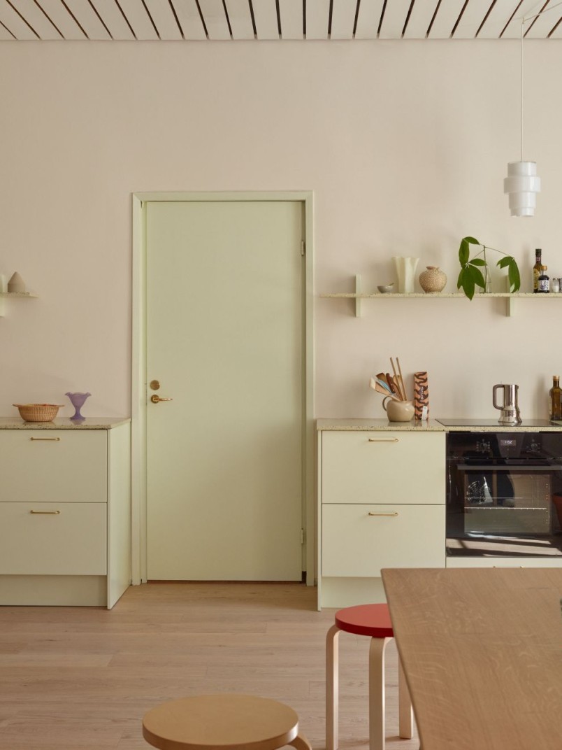 beige colour wall and muted colour interior elements in design studio