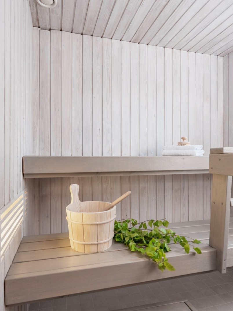 white colour sauna with light grey bench