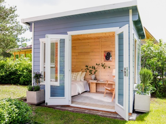 wooden garden cabin with soothing colours