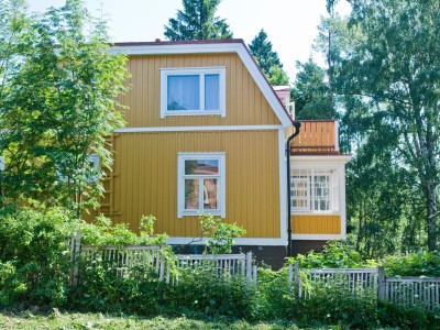 painting wooden house facade
