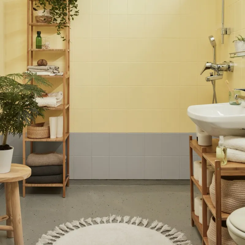 bright bathroom painted with yellow and grey colour