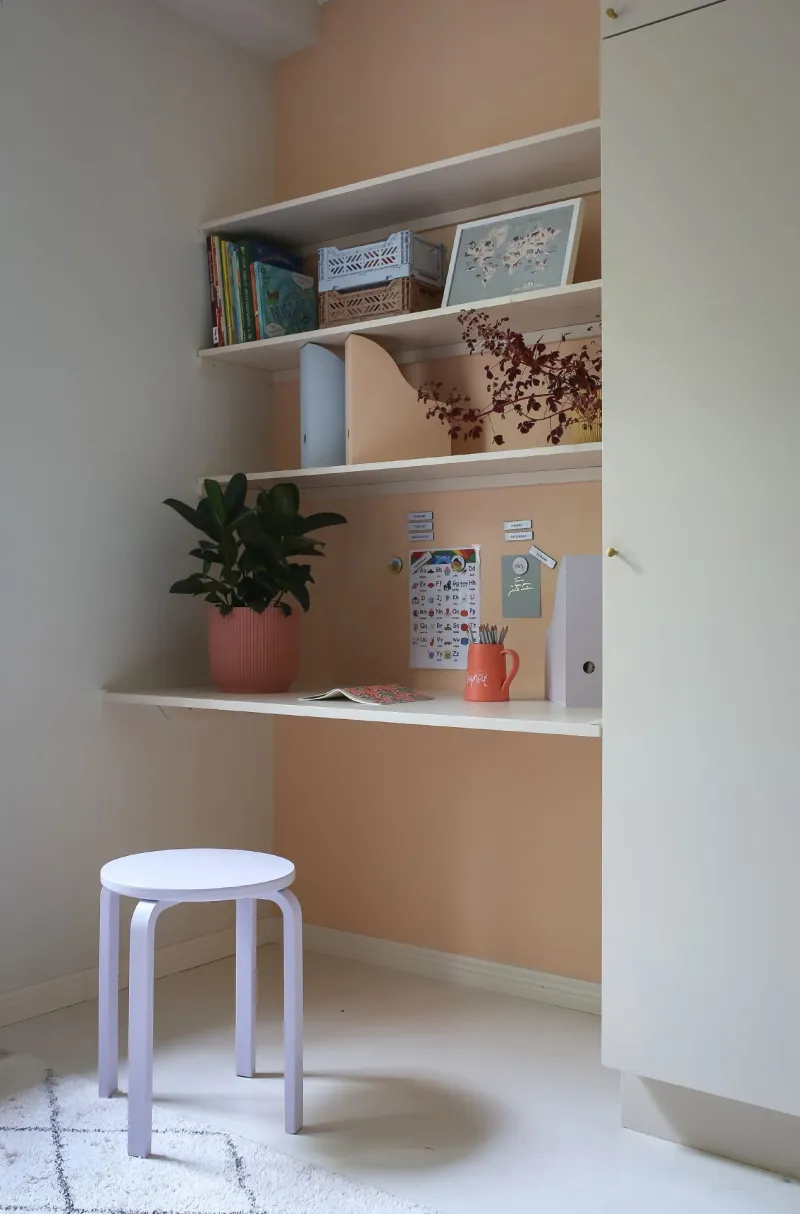 light beige colour wall and built in shelf with colourful items