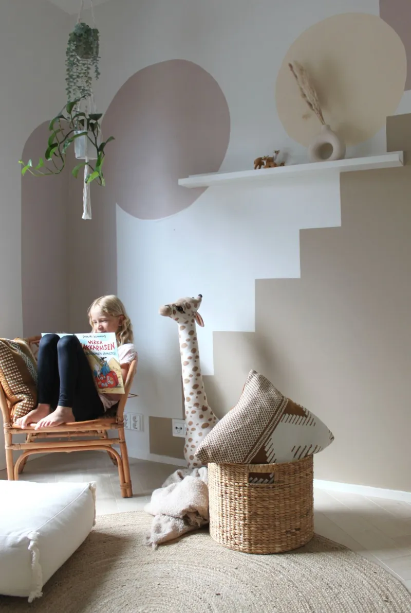 kids room wall with muted beige and pastel colour patterns
